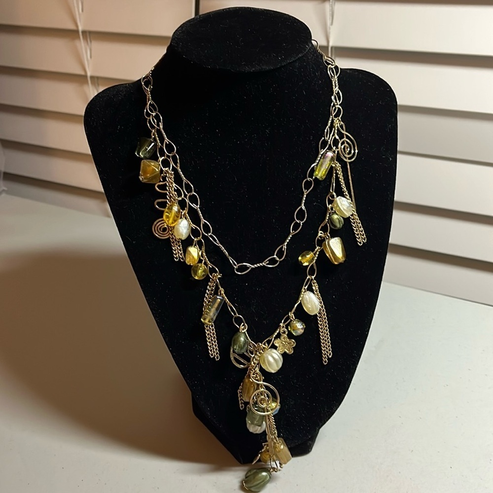 Charm necklace with earth, tone beads